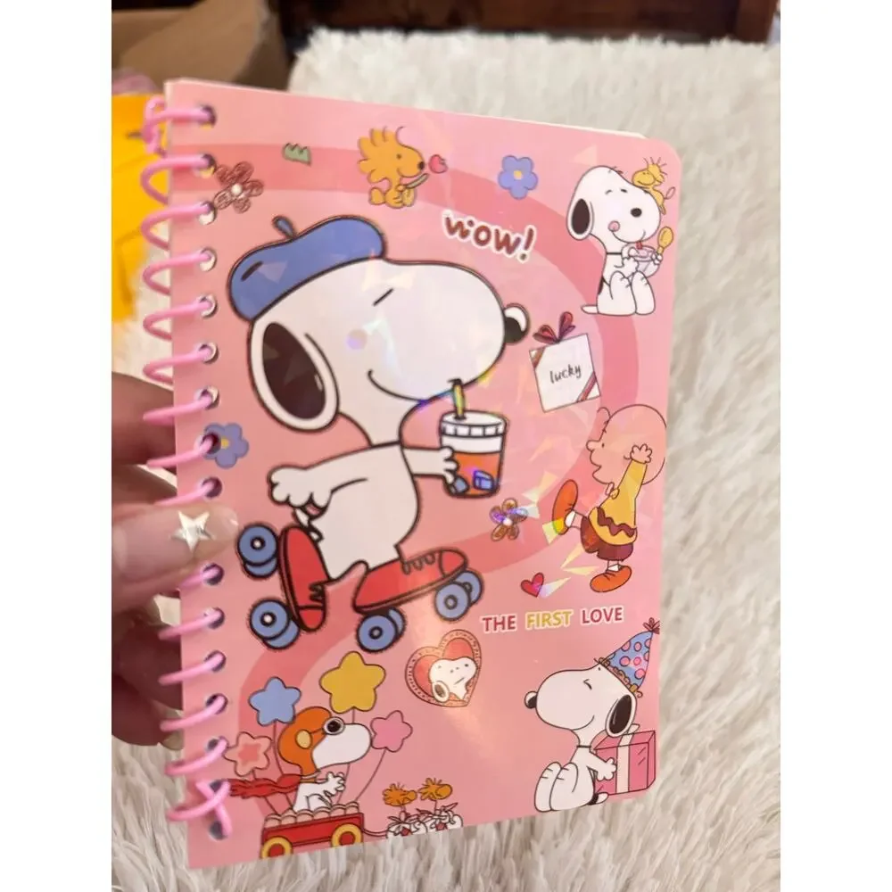 Snoopy spiral pink notebook with pen featuring Snoopy on roller skate size A6 .